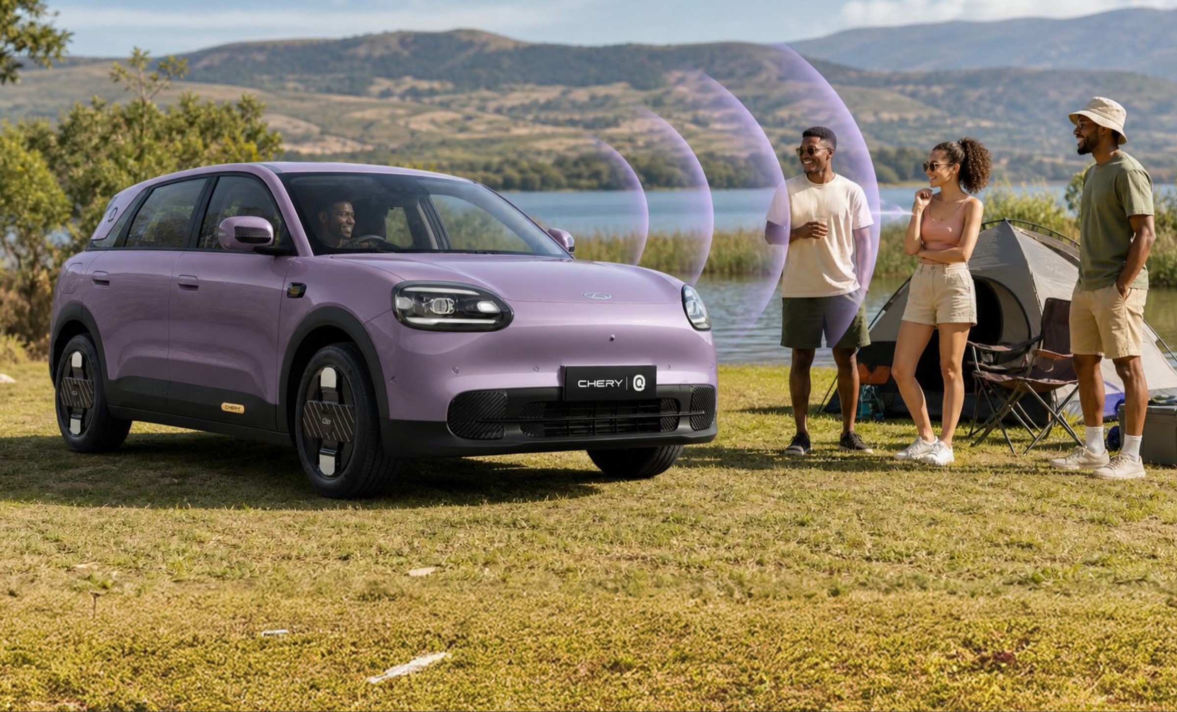 Chery Q projecting sound toward campers beside a lake